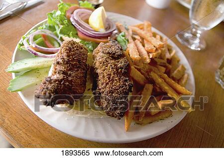 a plate of fried foods and salad; tofino, british columbia, canada View Large Photo Image Stock Photography - a plate of fried foods and salad; tofino, british columbia, canada. Fotosearch