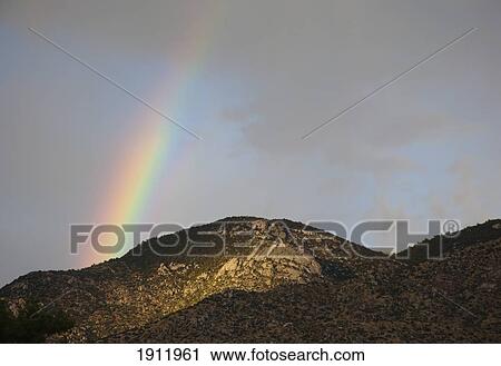 a rainbow over a mountain ridge; new mexico, united states of america View Large Photo Image Stock Image - a rainbow over a mountain ridge; new mexico, united states of america. Fotosearch