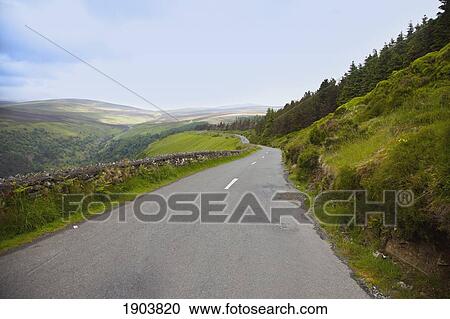 a road traveling through irish landscape; county wicklow, ireland View Large Photo Image Stock Image - a road traveling through irish landscape; county wicklow, ireland. Fotosearch