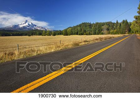 a road with mount hood in the background; oregon, united states of america View Large Photo Image Stock Image - a road with mount hood in the background; oregon, united states of america. Fotosearch