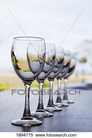 a row of wine glasses; gold coast, queensland, australia View Large Photo Image Stock Photography - a row of wine glasses; gold coast, queensland, australia. Fotosearch