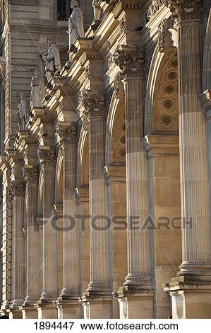 a series of stone pillars highlighted at sunset in the louvre courtyard; paris, france View Large Photo Image Stock Photo - a series of stone pillars highlighted at sunset in the louvre courtyard; paris, france. Fotosearch