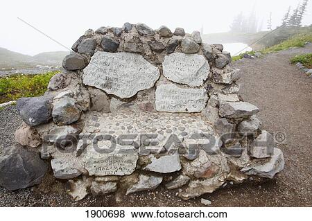 a variety of rocks forming a bench on a hiking trail in the fog in paradise park in mt. rainier national park; washington, united states of america View Large Photo Image Stock Photo - a variety of rocks forming a bench on a hiking trail in the fog in paradise park in mt. rainier national park; washington, united states of america. Fotosearch