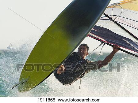 Stock Photography - a windsurfer; tarifa, cadiz, andalusia, spain. Fotosearch