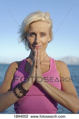 a woman doing a yoga pose in parque natural del estrecho; tarifa, cadiz, andalusia, spain View Large Photo Image Stock Image - a woman doing a yoga pose in parque natural del estrecho; tarifa, cadiz, andalusia, spain. Fotosearch