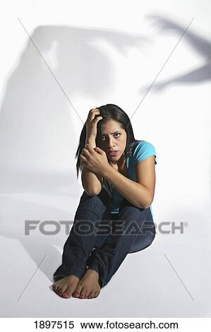 a woman with a frightened look View Large Photo Image Stock Photography - a woman with a frightened look. Fotosearch