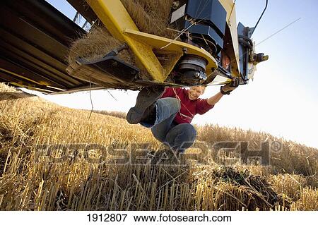 a woman with her farm equipment; three hills, alberta, canada View Large Photo Image Stock Photo - a woman with her farm equipment; three hills, alberta, canada. Fotosearch