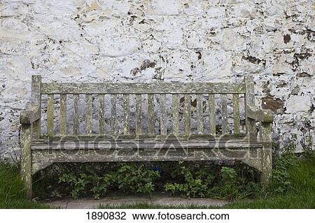 a wooden bench with peeling paint against a white wall; northumberland, england View Large Photo Image Stock Image - a wooden bench with peeling paint against a white wall; northumberland, england. Fotosearch