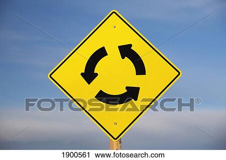 a yellow sign showing three arrows going in a circle; calgary, alberta, canada View Large Photo Image Stock Image - a yellow sign showing three arrows going in a circle; calgary, alberta, canada. Fotosearch