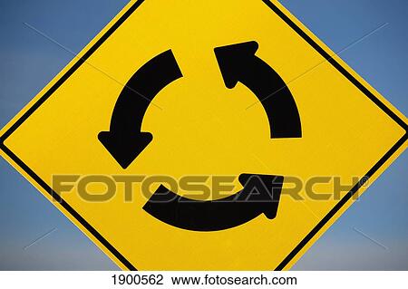 a yellow sign showing three arrows going in a circle; calgary, alberta, canada View Large Photo Image Stock Image - a yellow sign showing three arrows going in a circle; calgary, alberta, canada. Fotosearch