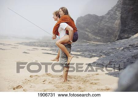 a young couple at the beach; portugal View Large Photo Image Stock Image - a young couple at the beach; portugal. Fotosearch