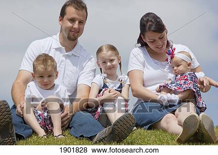 Stock Photo - a young family in the park; portland, oregon, united states of america. Fotosearch