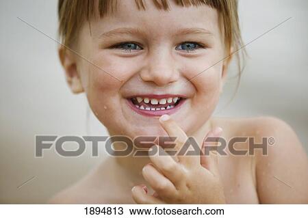 a young girl smiles; currumbin, gold coast, queensland, australia View Large Photo Image Stock Image - a young girl smiles; currumbin, gold coast, queensland, australia. Fotosearch