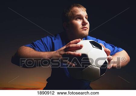 a young man with a soccer ball; wilmar, minnesota, united states of america View Large Photo Image Stock Image - a young man with a soccer ball; wilmar, minnesota, united states of america. Fotosearch