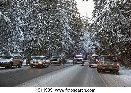 an emergency vehicle makes it's way through heavy traffic after a snow storm on mount hood; oregon, united states of america View Large Photo Image Stock Photo - an emergency vehicle makes it's way through heavy traffic after a snow storm on mount hood; oregon, united states of america. Fotosearch