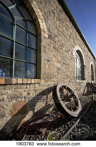 an old wheel at the side of a stone building; beamish, durham, england View Large Photo Image Stock Image - an old wheel at the side of a stone building; beamish, durham, england. Fotosearch
