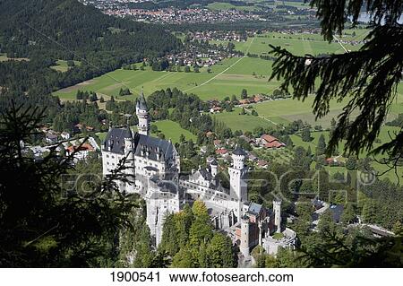 bavarian castle on a mountain side with fields and a village in the background; fussen, germany View Large Photo Image Stock Image - bavarian castle on a mountain side with fields and a village in the background; fussen, germany. Fotosearch