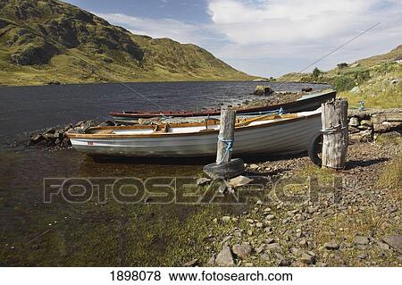 boat on lough fee on the renvyle peninsula in the connacht region; county galway, ireland View Large Photo Image Stock Photo - boat on lough fee on the renvyle peninsula in the connacht region; county galway, ireland. Fotosearch