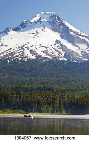 boating in trillium lake with mount hood in the background in the oregon cascades; oregon, united states of america View Large Photo Image Stock Photo - boating in trillium lake with mount hood in the background in the oregon cascades; oregon, united states of america. Fotosearch