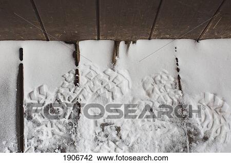 Stock Image - boot prints in the snow; french alps, france. Fotosearch