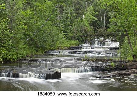 cascading falls along a creek; thunder bay, ontario, canada View Large Photo Image Stock Photo - cascading falls along a creek; thunder bay, ontario, canada. Fotosearch