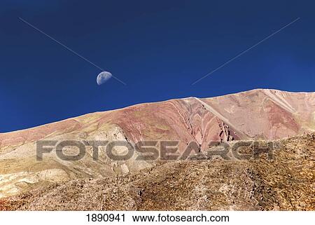 colorful hills with the moon in the blue sky; tilcara, argentina View Large Photo Image Stock Image - colorful hills with the moon in the blue sky; tilcara, argentina. Fotosearch