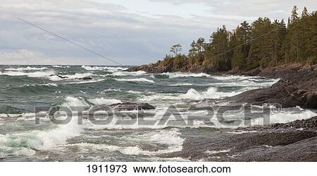 Stock Image - crashing waves on the rocky shoreline of lake superior near wawa; ontario, canada. Fotosearch