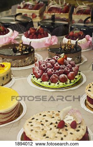 decorative cakes on display in a pastry store window; paris, france View Large Photo Image Stock Image - decorative cakes on display in a pastry store window; paris, france. Fotosearch