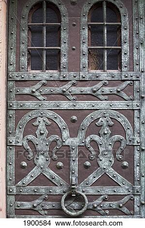 decorative metal design on a door with a metal door knocker; freiburg, germany View Large Photo Image Picture - decorative metal design on a door with a metal door knocker; freiburg, germany. Fotosearch