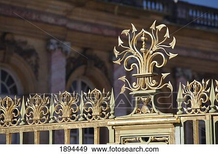 Stock Photo - detail of the gold fencing around the grand trianon gates in the gardens in the palace of versailles; paris, france. Fotosearch