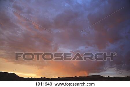 Stock Image - dramatic light of a sunset over the desert; arizona, united states of america. Fotosearch