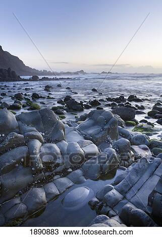 Stock Image - duckpool bay at dusk; north cornwall, england. Fotosearch