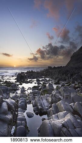 Stock Image - duckpool bay at sunset; north cornwall, england. Fotosearch