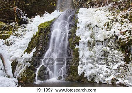 first winter snow along cabin creek falls in columbia river gorge national scenic area; oregon, united states of america View Large Photo Image Stock Photo - first winter snow along cabin creek falls in columbia river gorge national scenic area; oregon, united states of america. Fotosearch