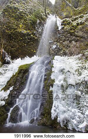 first winter snow along cabin creek falls in columbia river gorge national scenic area; oregon, united states of america View Large Photo Image Stock Photograph - first winter snow along cabin creek falls in columbia river gorge national scenic area; oregon, united states of america. Fotosearch