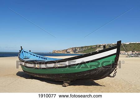 Stock Photo - fisherman's boat on the beach; nazare, estremadura and ribatejo, portugal. Fotosearch