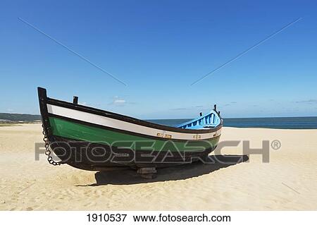 fisherman's boat on the beach; nazare, estremadua and ribatejo, portugal View Large Photo Image Stock Photo - fisherman's boat on the beach; nazare, estremadua and ribatejo, portugal. Fotosearch