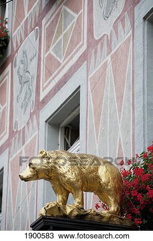 gold bear sculpture with flowers and a painted building; freiburg, germany View Large Photo Image Stock Image - gold bear sculpture with flowers and a painted building; freiburg, germany. Fotosearch