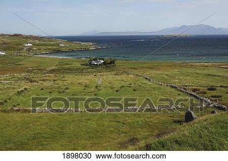 green fields and stone walls on inishbofin island off the coast in connacht region; county galway, ireland View Large Photo Image Stock Image - green fields and stone walls on inishbofin island off the coast in connacht region; county galway, ireland. Fotosearch