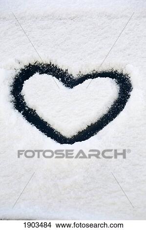 heart shape in snow on the windshield of a vehicle; calgary, alberta, canada View Large Photo Image Picture - heart shape in snow on the windshield of a vehicle; calgary, alberta, canada. Fotosearch