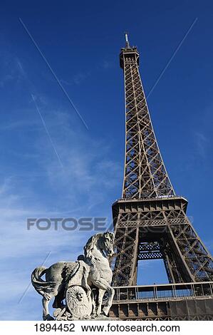horse statue and the eiffel tower against a blue sky; paris, france View Large Photo Image Stock Image - horse statue and the eiffel tower against a blue sky; paris, france. Fotosearch