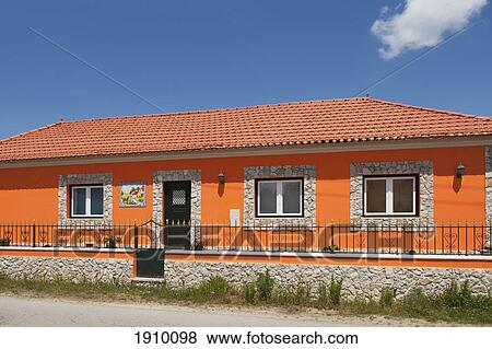 Stock Photo - house painted orange; leiria, estremadura and ribatejo, portugal. Fotosearch