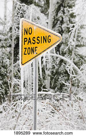 ice covered street sign that says, 'no passing zone'; minnesota, united states of america View Large Photo Image Stock Photo - ice covered street sign that says, 'no passing zone'; minnesota, united states of america. Fotosearch