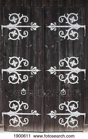 large metal decorative hinges on a weathered wooden barn door; fussen, germany View Large Photo Image Stock Image - large metal decorative hinges on a weathered wooden barn door; fussen, germany. Fotosearch