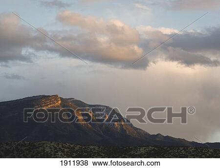 last light of the setting sun catches the sandia mountains, viewed from placitas; new mexico, united states of america View Large Photo Image Stock Photo - last light of the setting sun catches the sandia mountains, viewed from placitas; new mexico, united states of america. Fotosearch