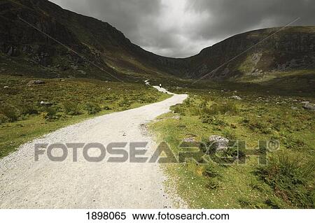 lone person walking on a path leading up to mahon falls in the comeragh mountains in munster region; county waterford, ireland View Large Photo Image Stock Photography - lone person walking on a path leading up to mahon falls in the comeragh mountains in munster region; county waterford, ireland. Fotosearch