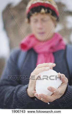 Stock Image - making a snowball; chamonix, france. Fotosearch