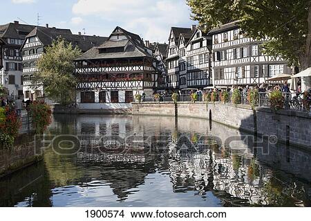 medieval timber style buildings reflected in a canal; strasbourg, france View Large Photo Image Picture - medieval timber style buildings reflected in a canal; strasbourg, france. Fotosearch