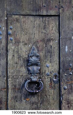 metal door knocker on a weathered wooden door; fussen, germany View Large Photo Image Stock Image - metal door knocker on a weathered wooden door; fussen, germany. Fotosearch