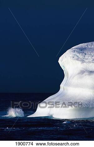 ocean water splashing against an iceberg in the high arctic waters; nunavut, canada View Large Photo Image Picture - ocean water splashing against an iceberg in the high arctic waters; nunavut, canada. Fotosearch